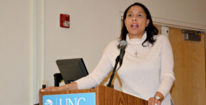 A photo of Ange Marie Hancock speaking at a podium