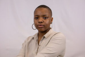 Headshot photo of Jailyn Neville wearing a beige top